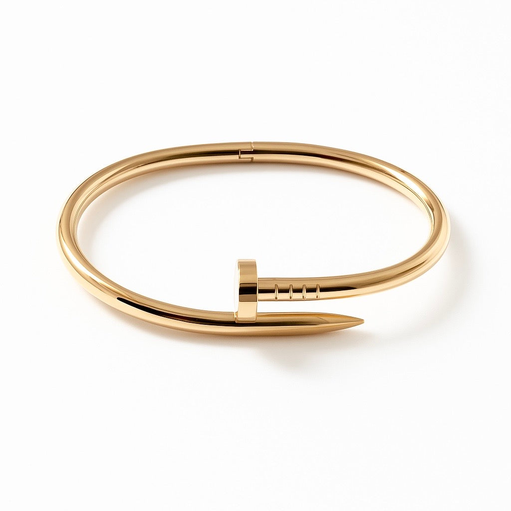 Gold bracelet with a unique clasp design on a white background
