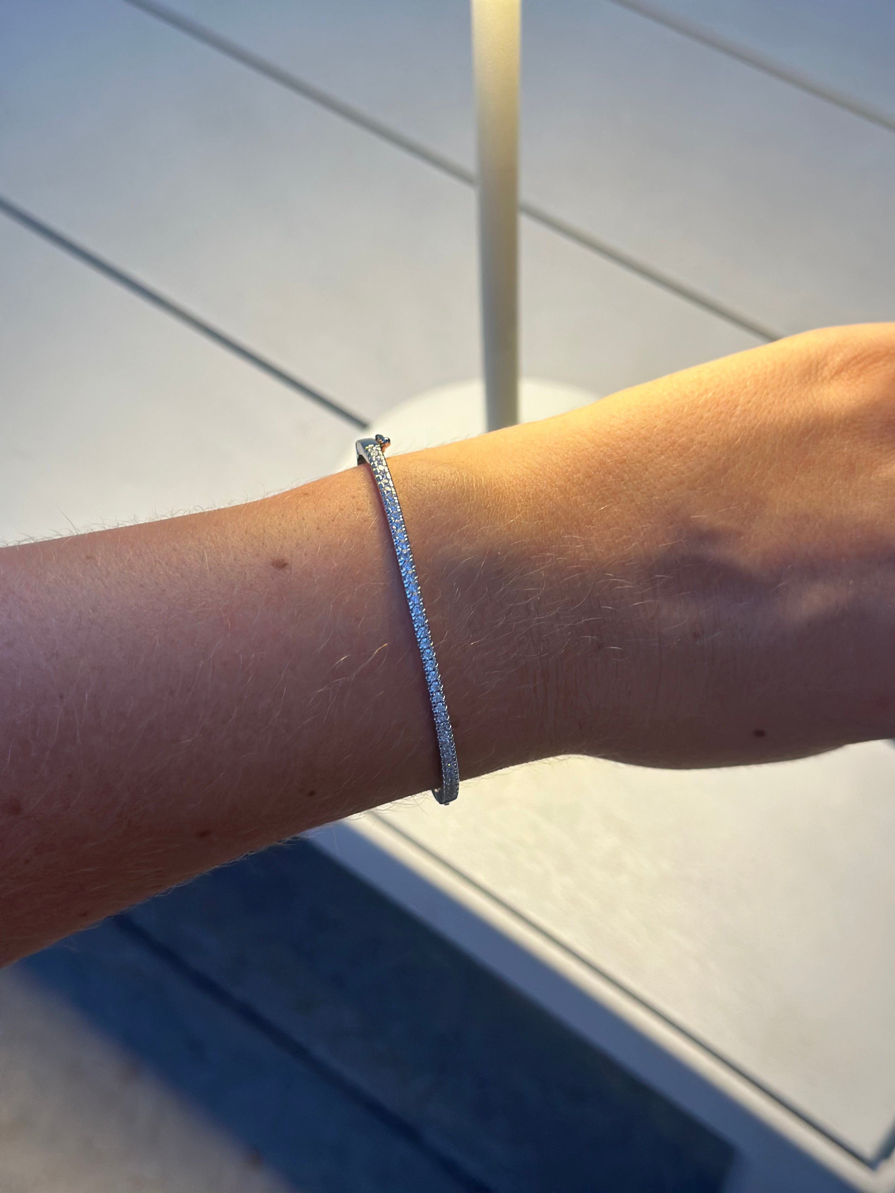 Close-up of a wrist wearing a bracelet with a blurred background